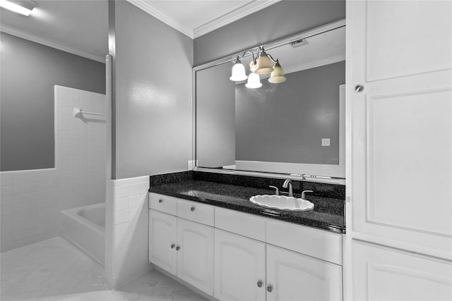 bathroom with tile patterned floors, vanity, tile walls, and ornamental molding