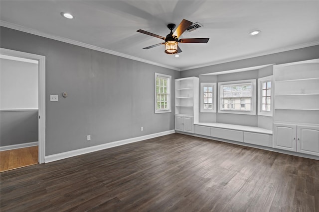 unfurnished room with ornamental molding, dark wood-type flooring, and ceiling fan