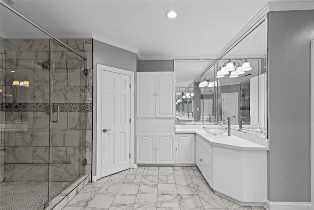 bathroom with ornamental molding, an enclosed shower, and vanity