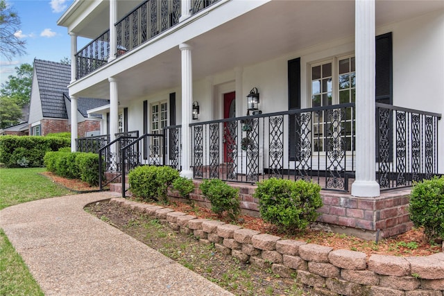 view of exterior entry with a porch