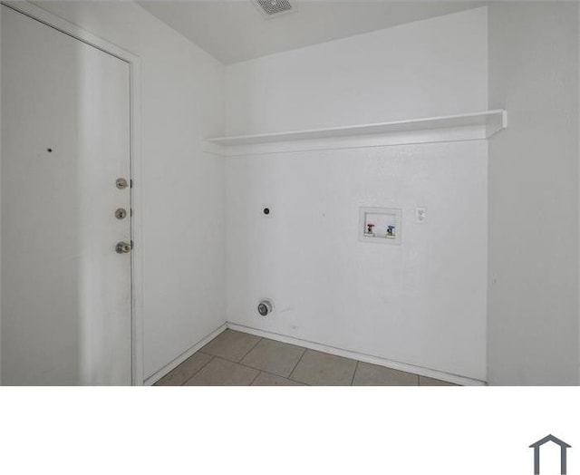 clothes washing area featuring hookup for a washing machine, light tile patterned flooring, and hookup for an electric dryer