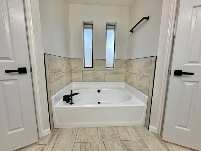 bathroom featuring a washtub