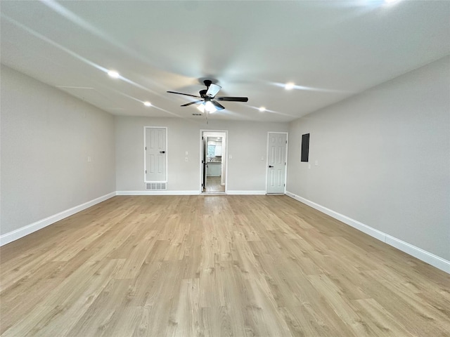 empty room featuring light wood-type flooring and ceiling fan