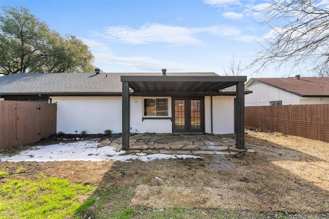 rear view of property with french doors