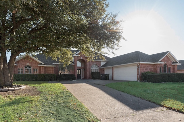 view of front of home featuring a garage and a front lawn