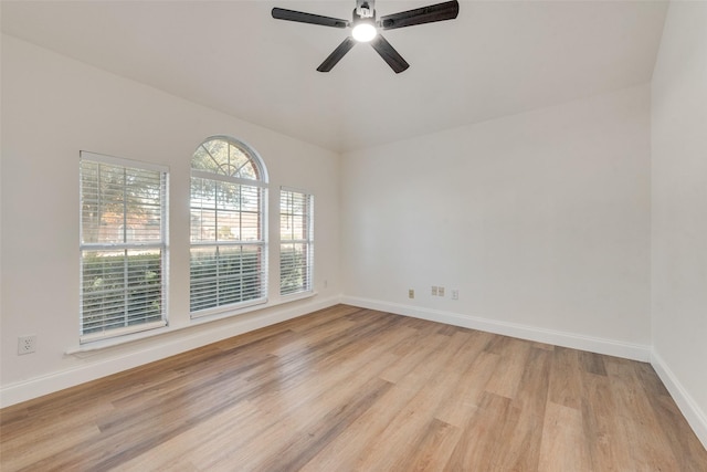 spare room featuring light wood-type flooring and ceiling fan