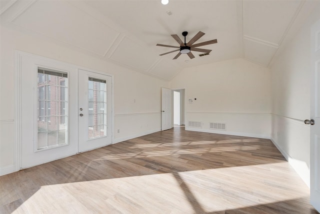 unfurnished room with french doors, hardwood / wood-style floors, ceiling fan, and vaulted ceiling