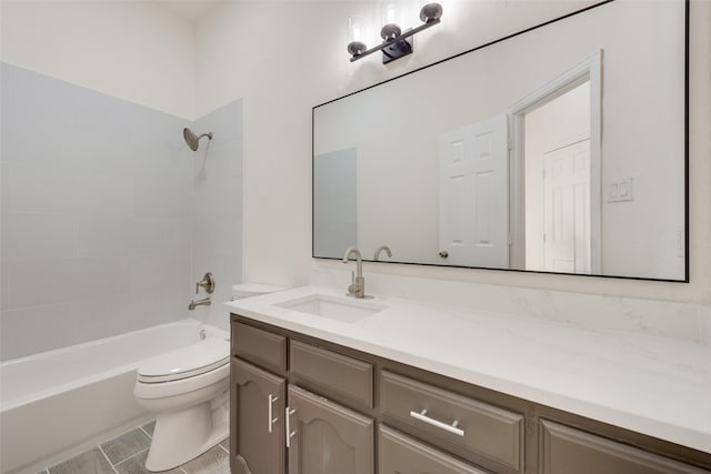 full bathroom featuring tile patterned floors, toilet, vanity, and tiled shower / bath