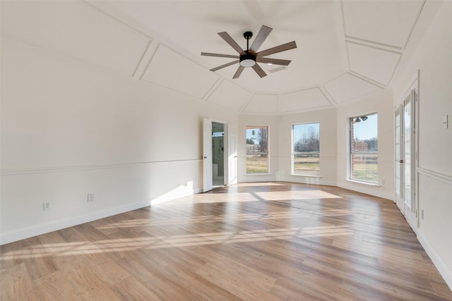 unfurnished room featuring lofted ceiling and ceiling fan