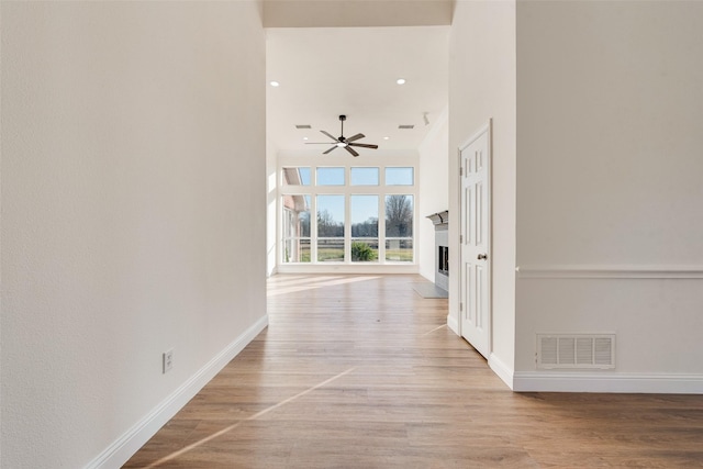 hallway with light wood-type flooring