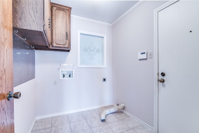 washroom featuring washer hookup, cabinet space, ornamental molding, light tile patterned flooring, and electric dryer hookup