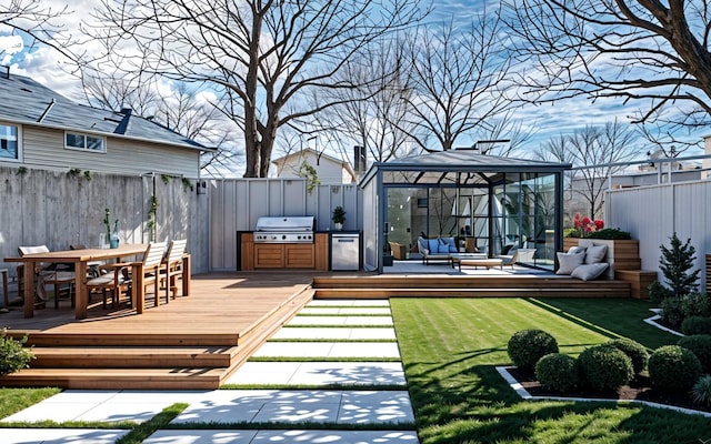 view of yard with outdoor dining area, outdoor lounge area, a gazebo, fence, and a wooden deck