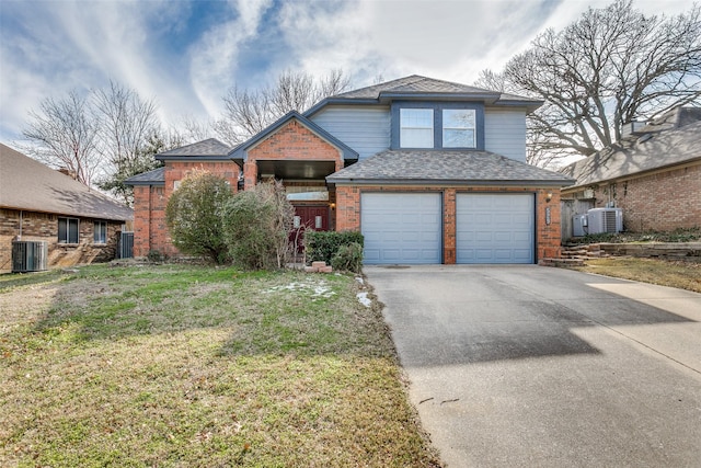 view of front facade with central air condition unit, a garage, brick siding, concrete driveway, and roof with shingles