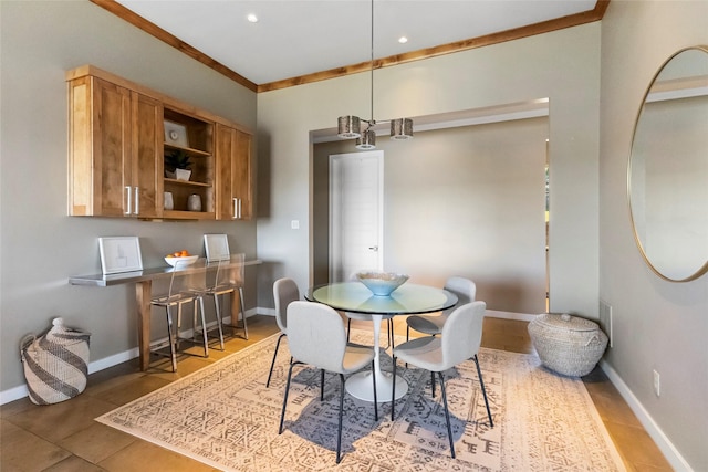 dining room featuring crown molding