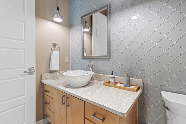 bathroom featuring vanity and toilet