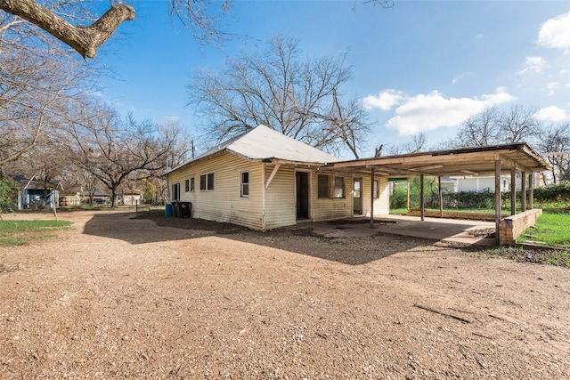 view of side of property featuring a carport