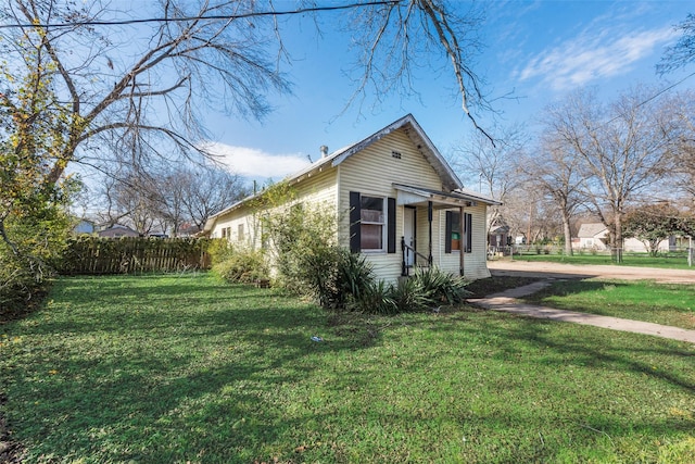 view of home's exterior with a yard