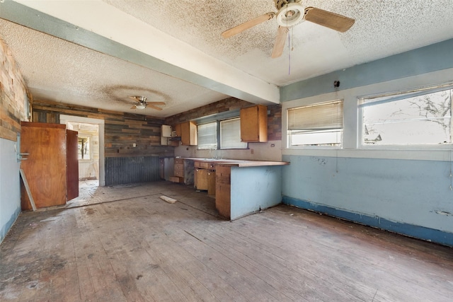 kitchen featuring kitchen peninsula and light wood-type flooring