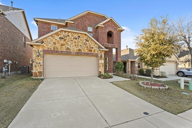 view of front of house with a front lawn, cooling unit, and a garage