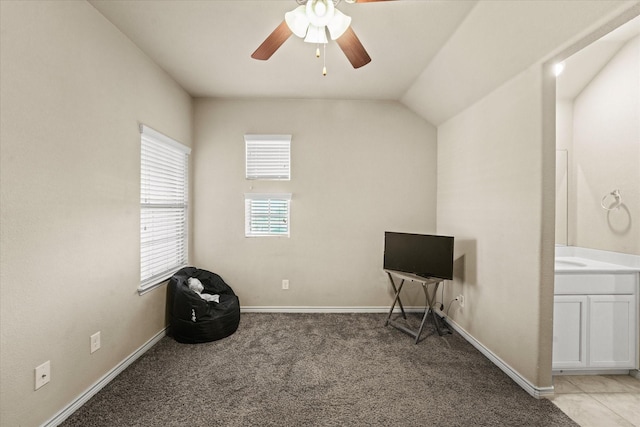 miscellaneous room with lofted ceiling, ceiling fan, and light carpet