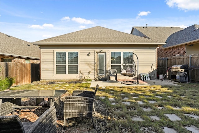 back of house with a patio