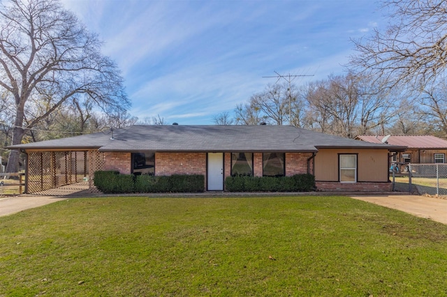 ranch-style house featuring a carport and a front lawn