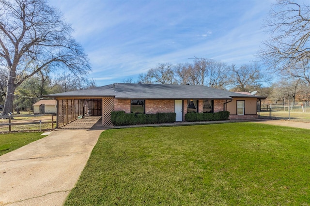 ranch-style home with a front lawn