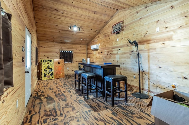 bar with wood ceiling, wooden walls, and vaulted ceiling