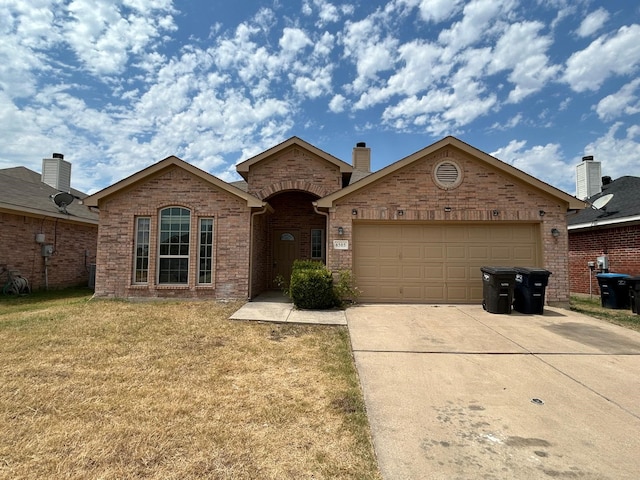 single story home featuring a front yard and a garage