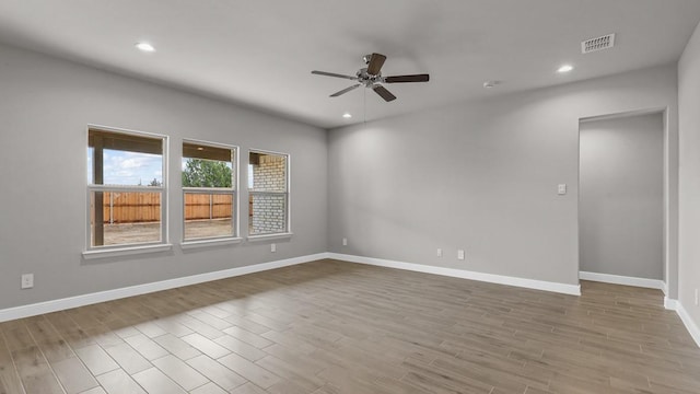 unfurnished room with ceiling fan