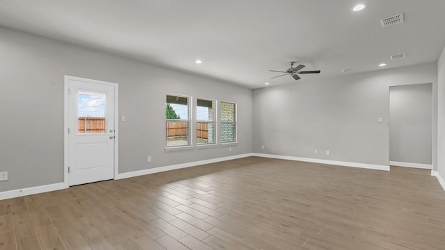 unfurnished room featuring ceiling fan and light hardwood / wood-style flooring