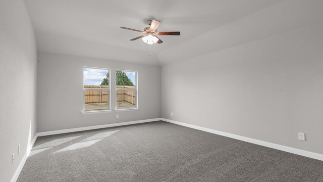 unfurnished room with carpet floors, ceiling fan, and vaulted ceiling