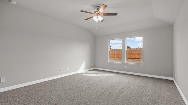 carpeted empty room featuring lofted ceiling and ceiling fan