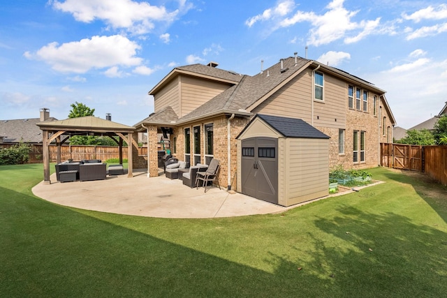 rear view of property featuring an outdoor hangout area, a patio area, a yard, a storage shed, and a gazebo