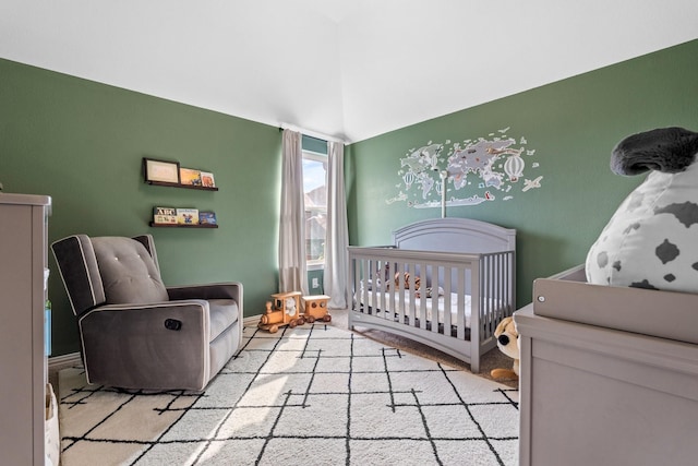 bedroom with a nursery area