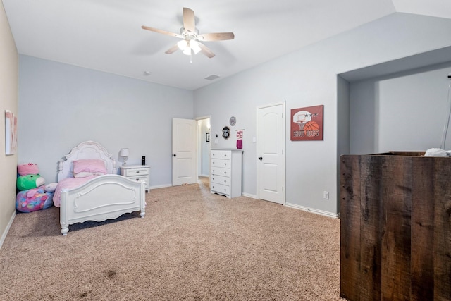 carpeted bedroom with ceiling fan and vaulted ceiling