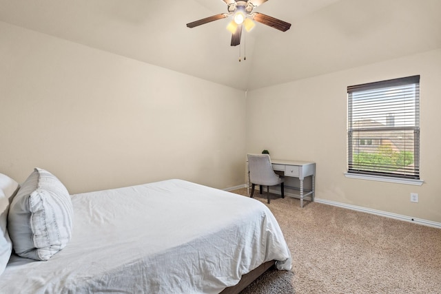 carpeted bedroom featuring vaulted ceiling and ceiling fan