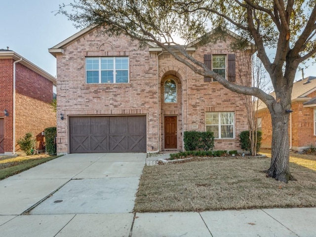 view of front of home featuring a front lawn and a garage