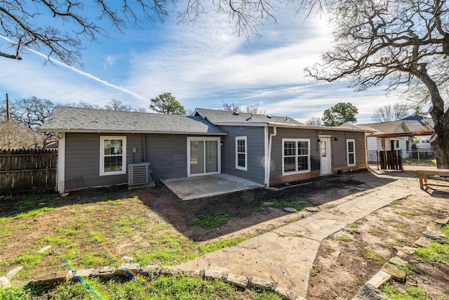 back of property featuring central AC unit and a patio