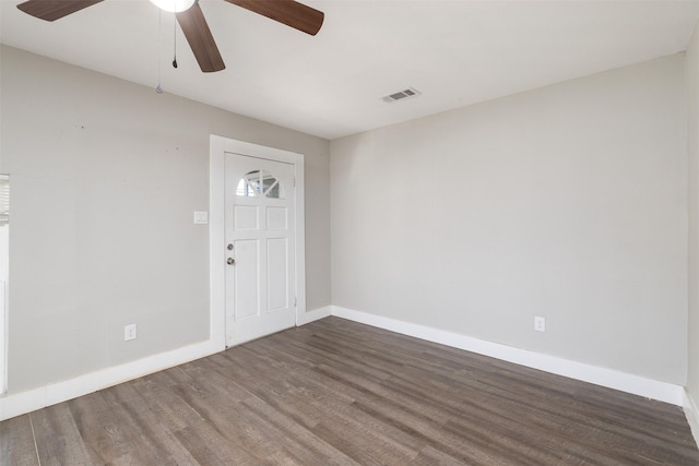 entrance foyer with ceiling fan and dark wood-type flooring