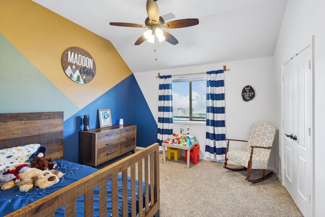 carpeted bedroom featuring a closet, ceiling fan, and vaulted ceiling