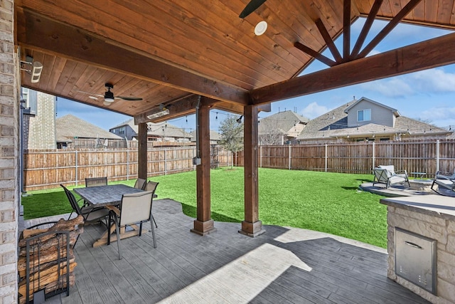 view of patio featuring ceiling fan and a wooden deck