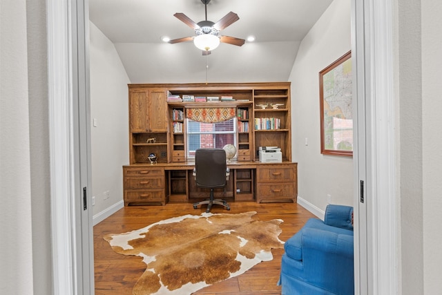 office space with ceiling fan, lofted ceiling, and light wood-type flooring