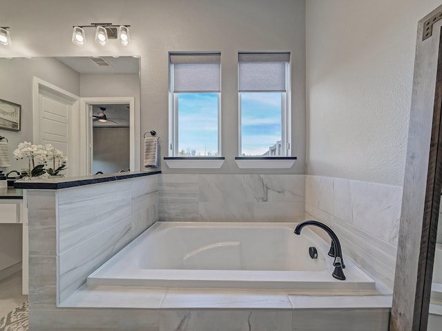 bathroom with tiled tub