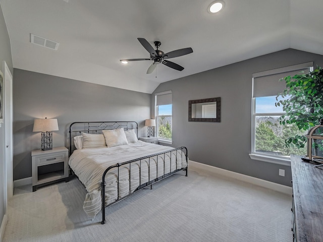 carpeted bedroom featuring ceiling fan and vaulted ceiling