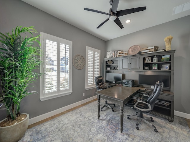 office space featuring ceiling fan and hardwood / wood-style flooring