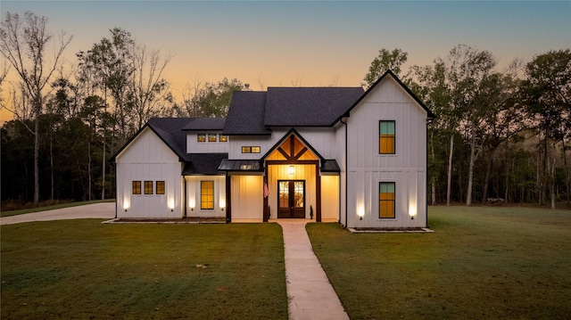 modern farmhouse with a yard