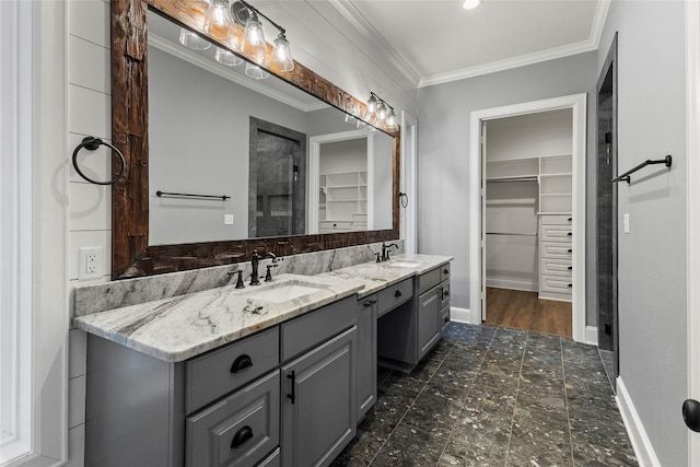 bathroom with ornamental molding and vanity