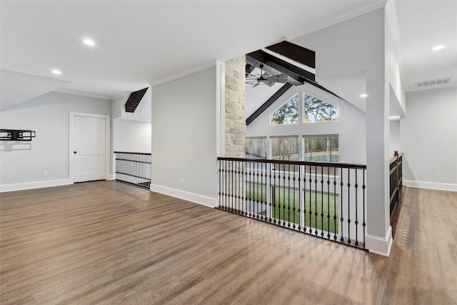 living room with ceiling fan, ornamental molding, and lofted ceiling with beams