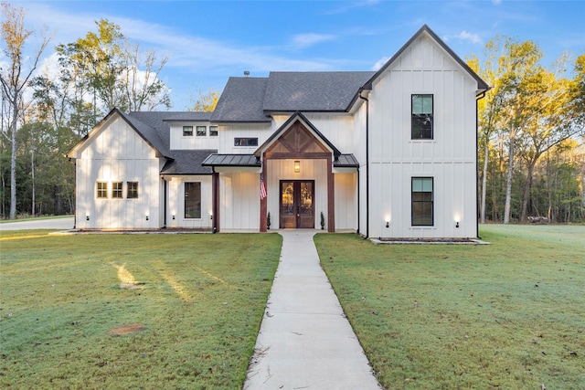 modern farmhouse style home featuring french doors and a front yard